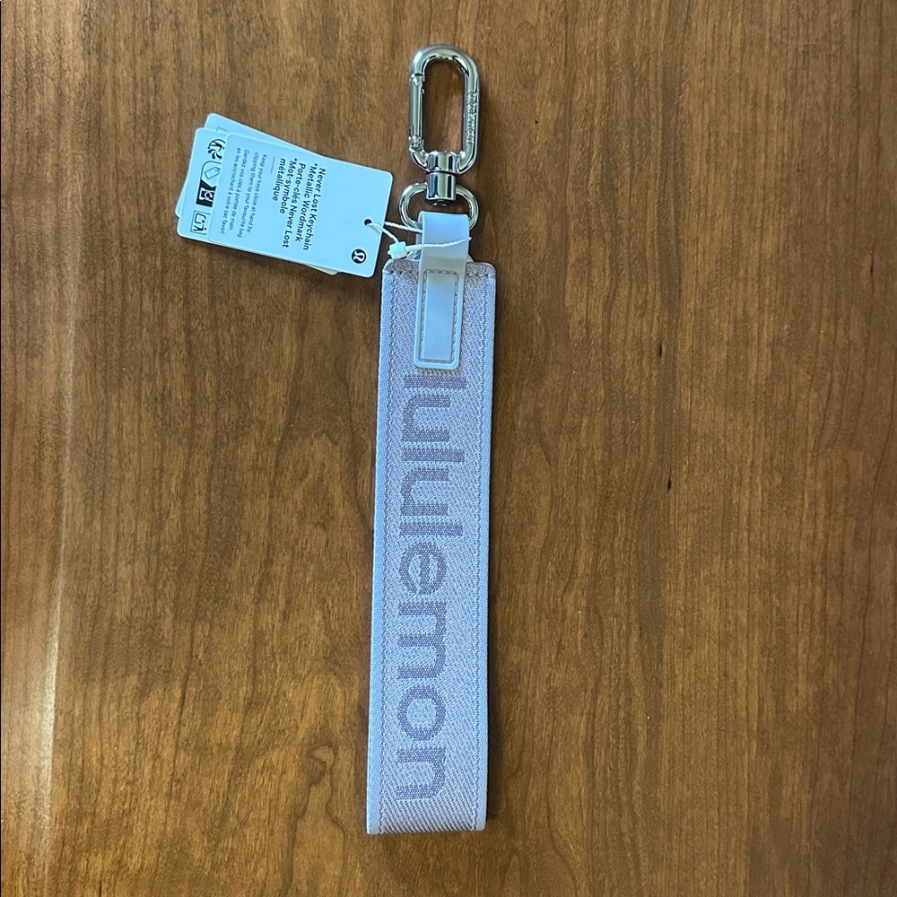 lululemon Never Lost metallic wordmark lavender Keychain NWT